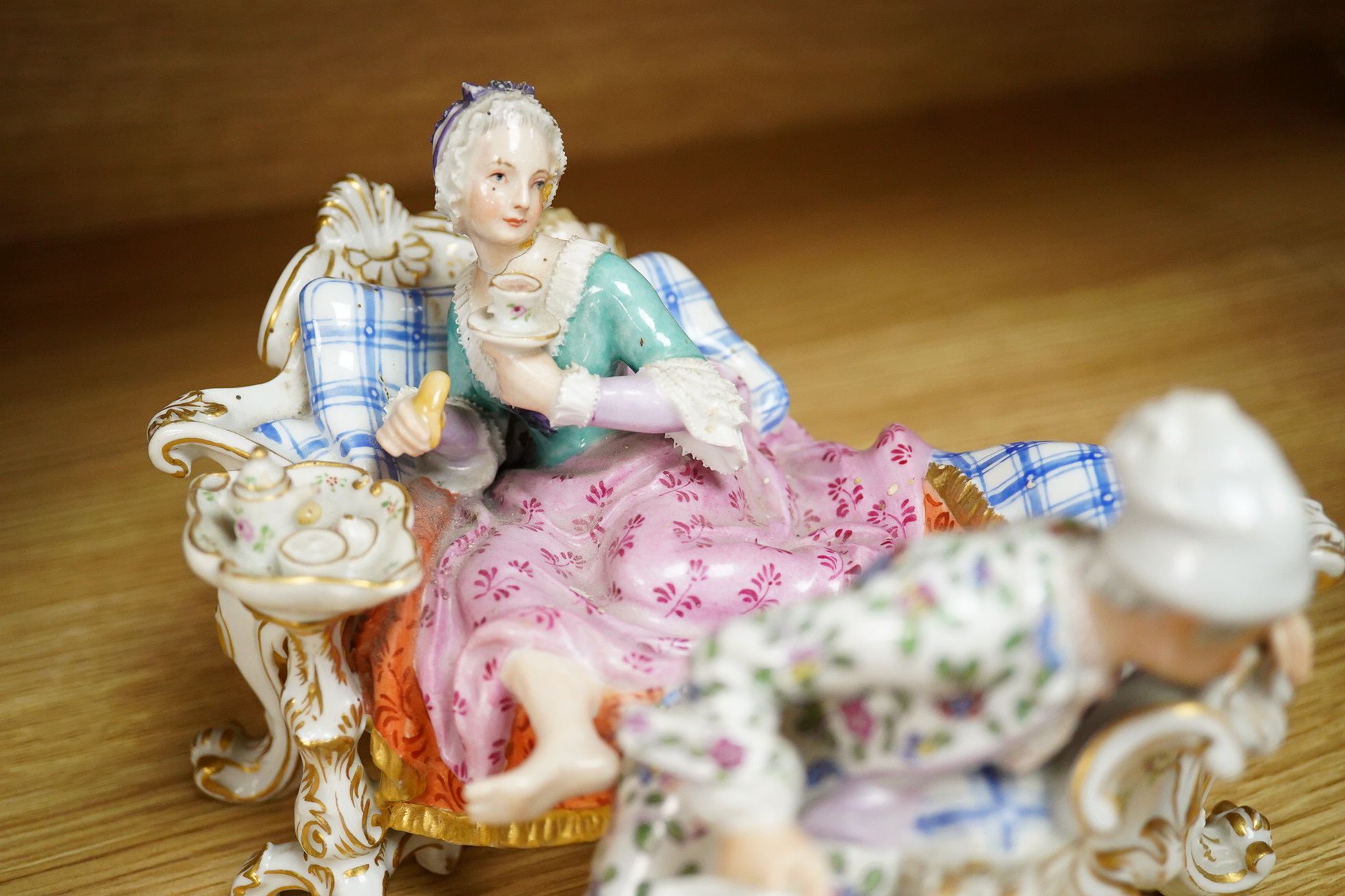 A Meissen style porcelain figure group ‘Discovered Lover’, 19cm wide